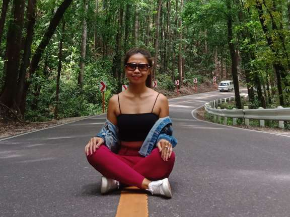 girl seating on the road